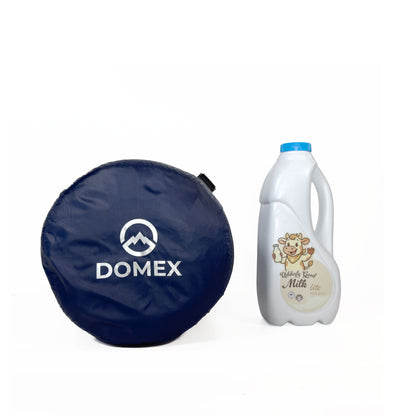 Scale image of top of compression sack for Domex Trailblazer 500 XT 3-season down bag next to 1 litre bottle of milk