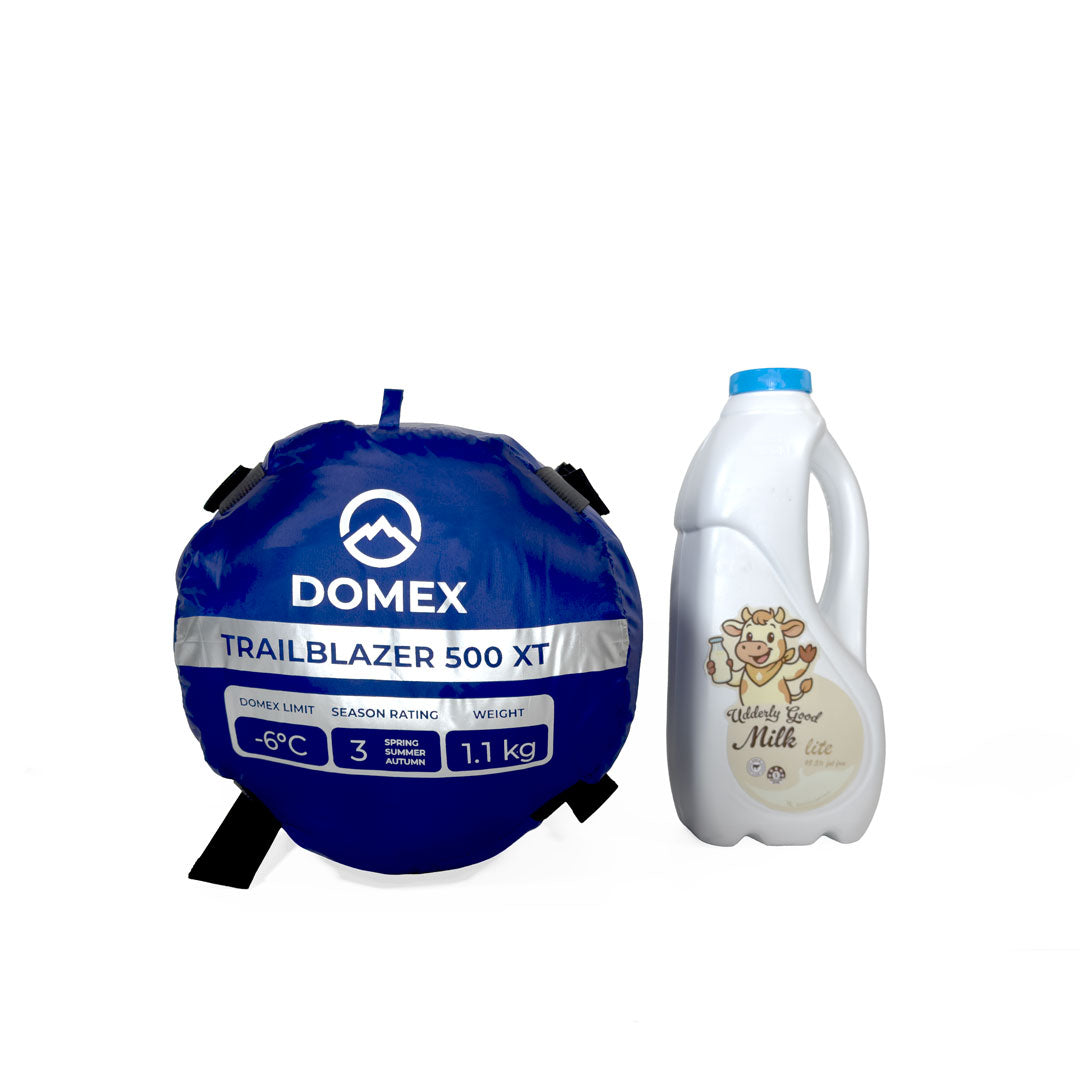Scale image of bottom of compression sack for Domex Trailblazer 500 XT 3-season down bag -6C / 1.1kg next to 1 litre bottle of milk
