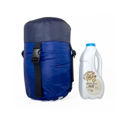 Scale image of compression sack for Domex Trailblazer 500 XT 3-season down bag on end next to 1 litre bottle of milk